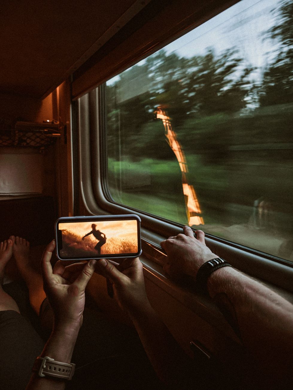 traveling by train with scenic phone display